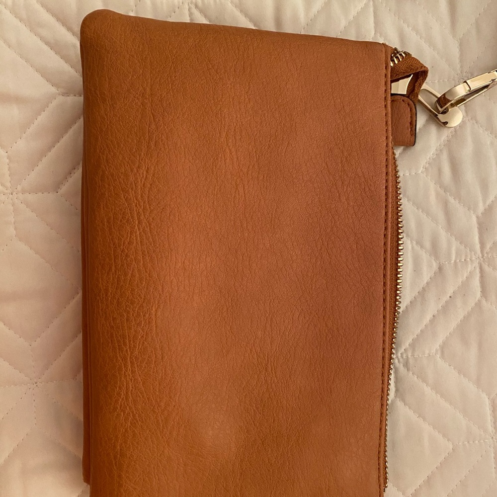 Gold cross-body bag coverts to wristlet